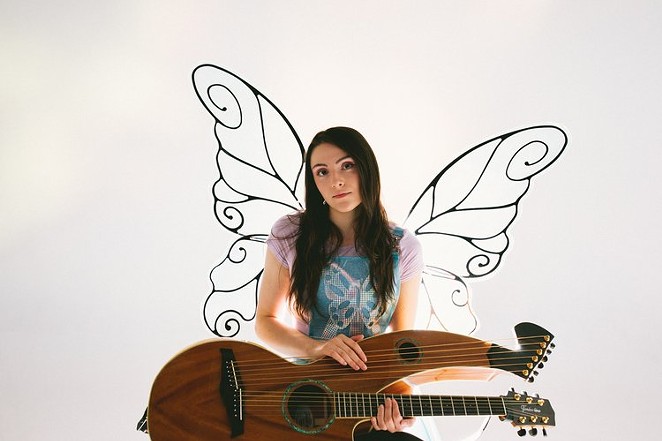 Maiah Wynne with wings & Harp Guitar