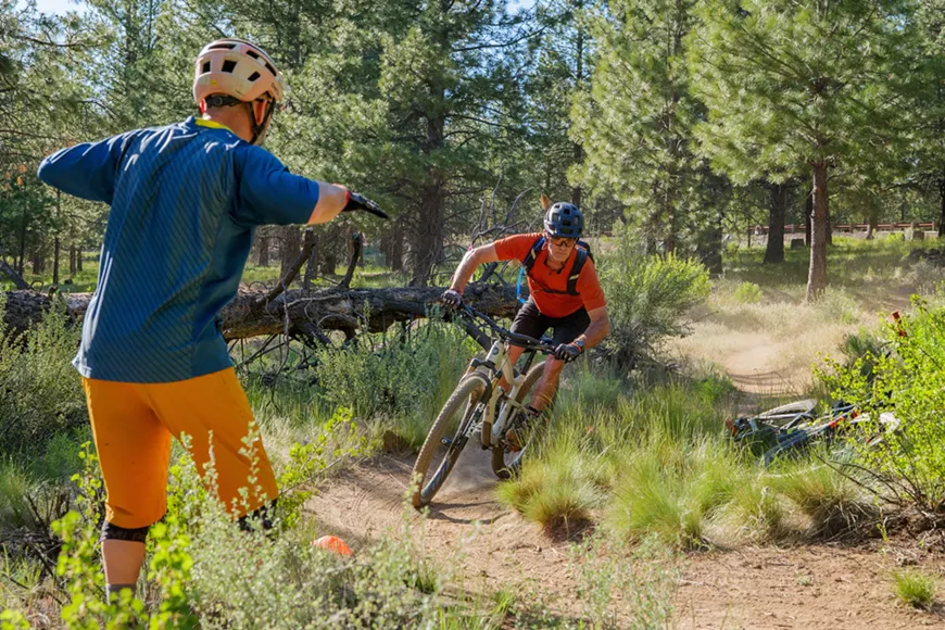 A rider practices getting low on a mountain bike during a Level 1 Progression Session with Cog Wild.