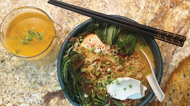 A bowl of ramen with an egg