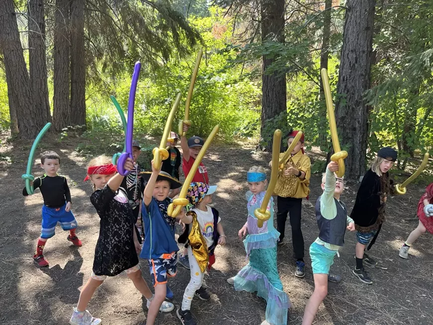 Starshine pirate Imagineers brandish their balloon swords