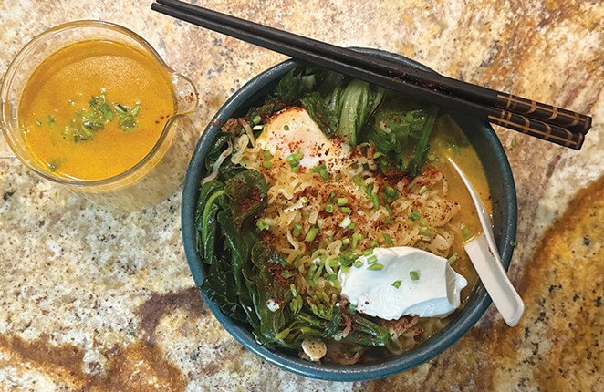 A bowl of ramen with an egg